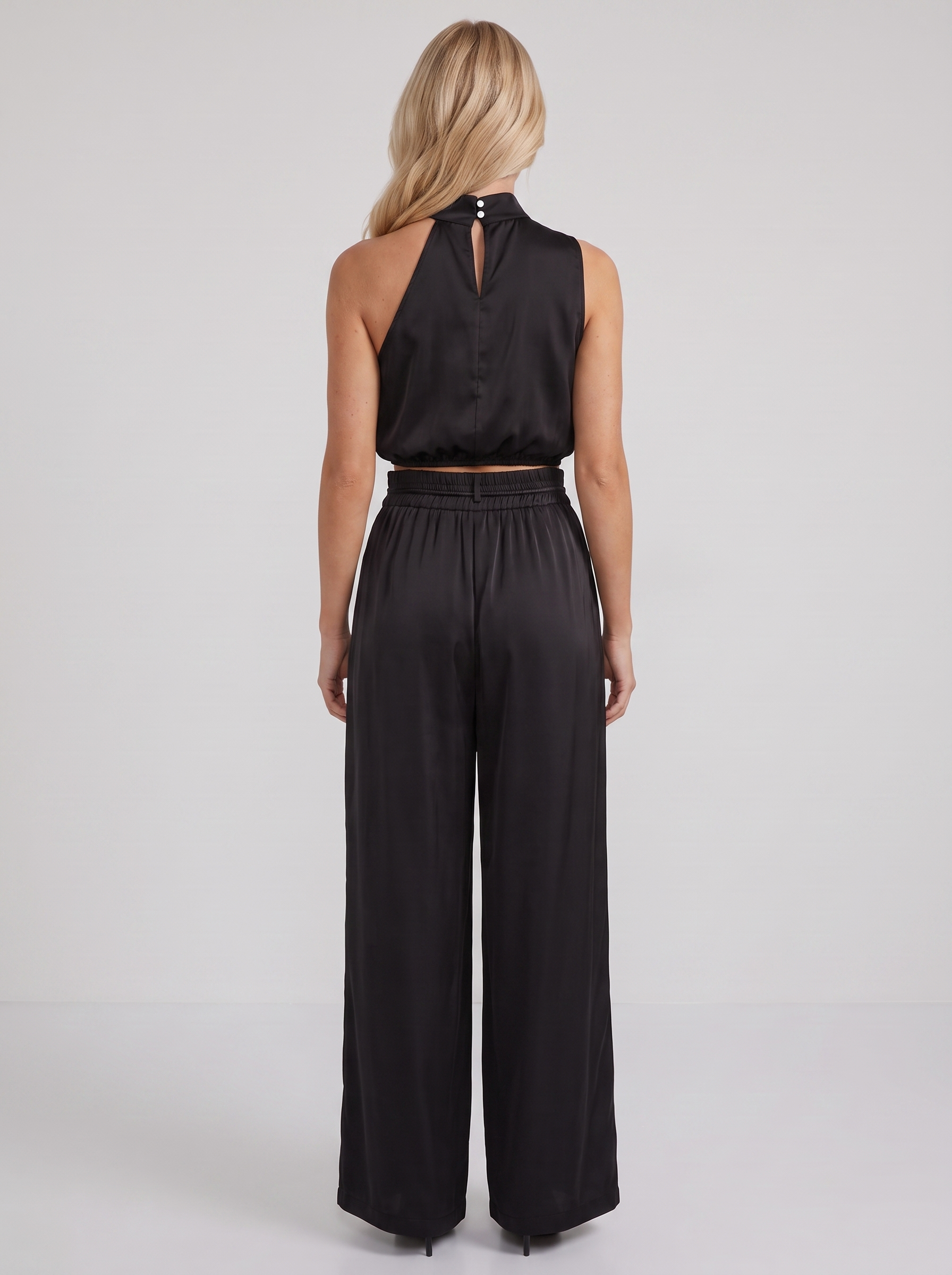 Women black pants set with halter crop top and draped satin front