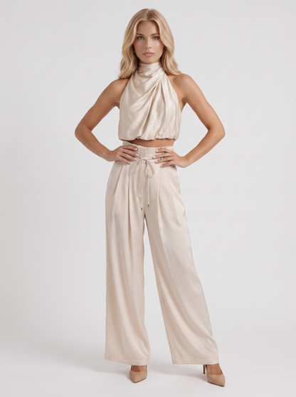 Women champagne pants set with halter crop top and draped satin front