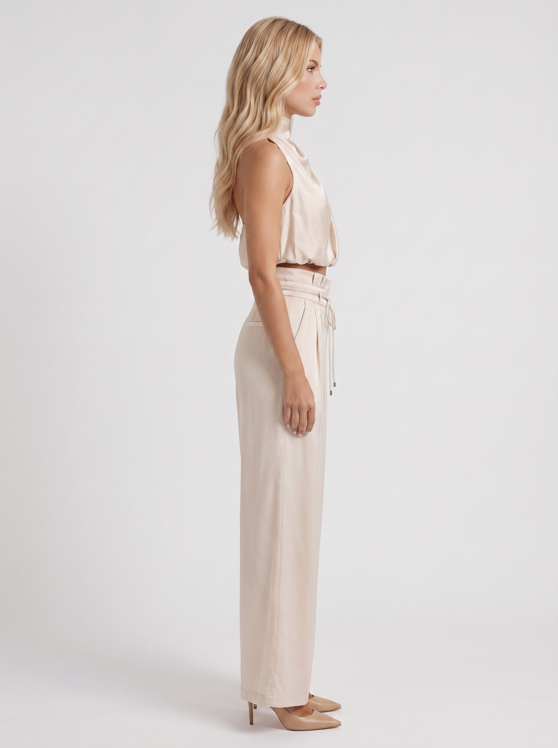 Women champagne pants set with halter crop top and draped satin front