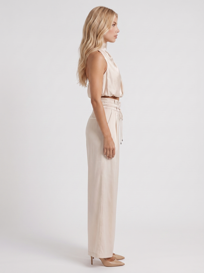 Women champagne pants set with halter crop top and draped satin front