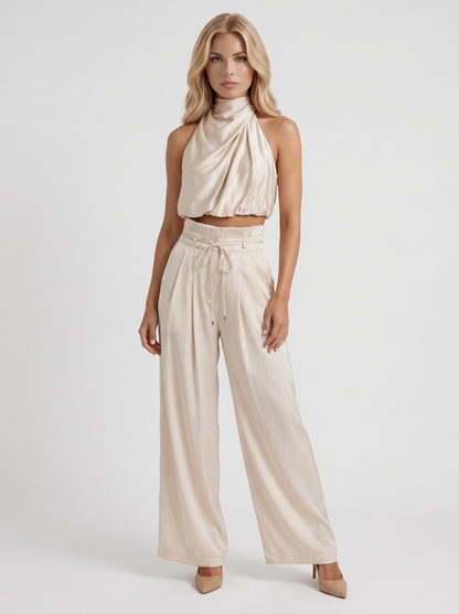 Women champagne pants set with halter crop top and draped satin front
