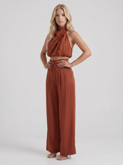 Women red pants set with halter crop top and draped satin front