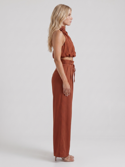 Women red pants set with halter crop top and draped satin front