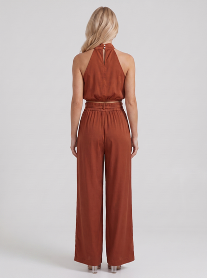 Women red pants set with halter crop top and draped satin front