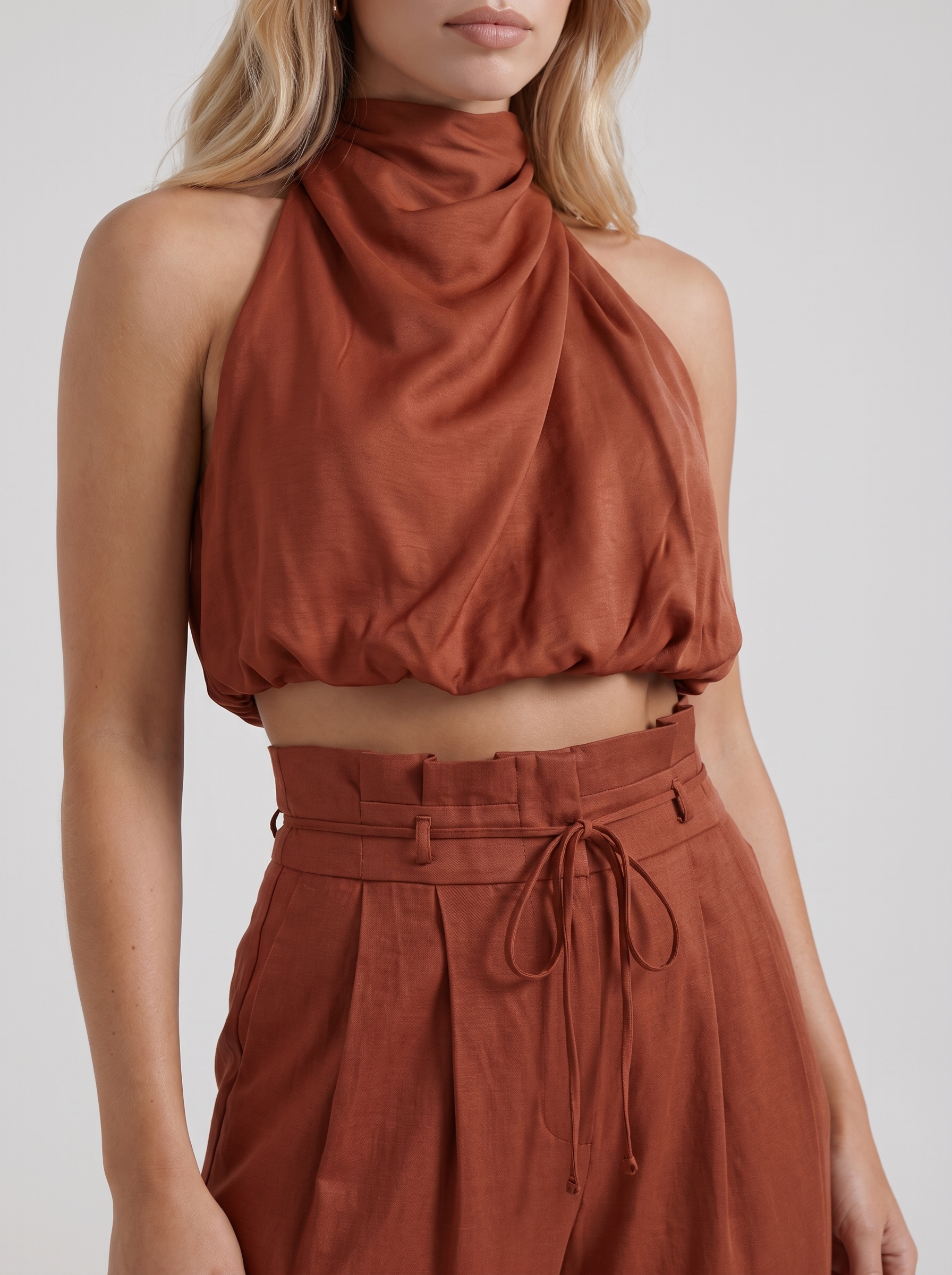 Women red pants set with halter crop top and draped satin front