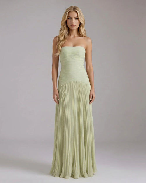 Full-length Kenzie Forest maxi dress in light green, featuring a strapless ruched bodice and a flowing pleated skirt.