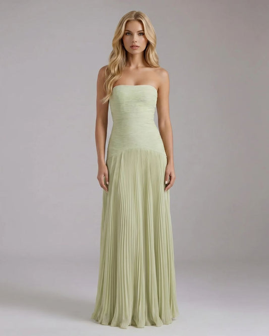 Full-length Kenzie Forest maxi dress in light green, featuring a strapless ruched bodice and a flowing pleated skirt.
