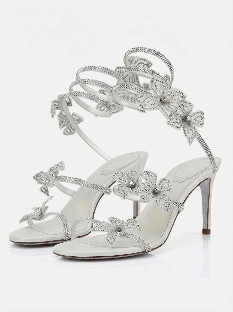 Women silver heeled sandals with wrap straps and rhinestone detail