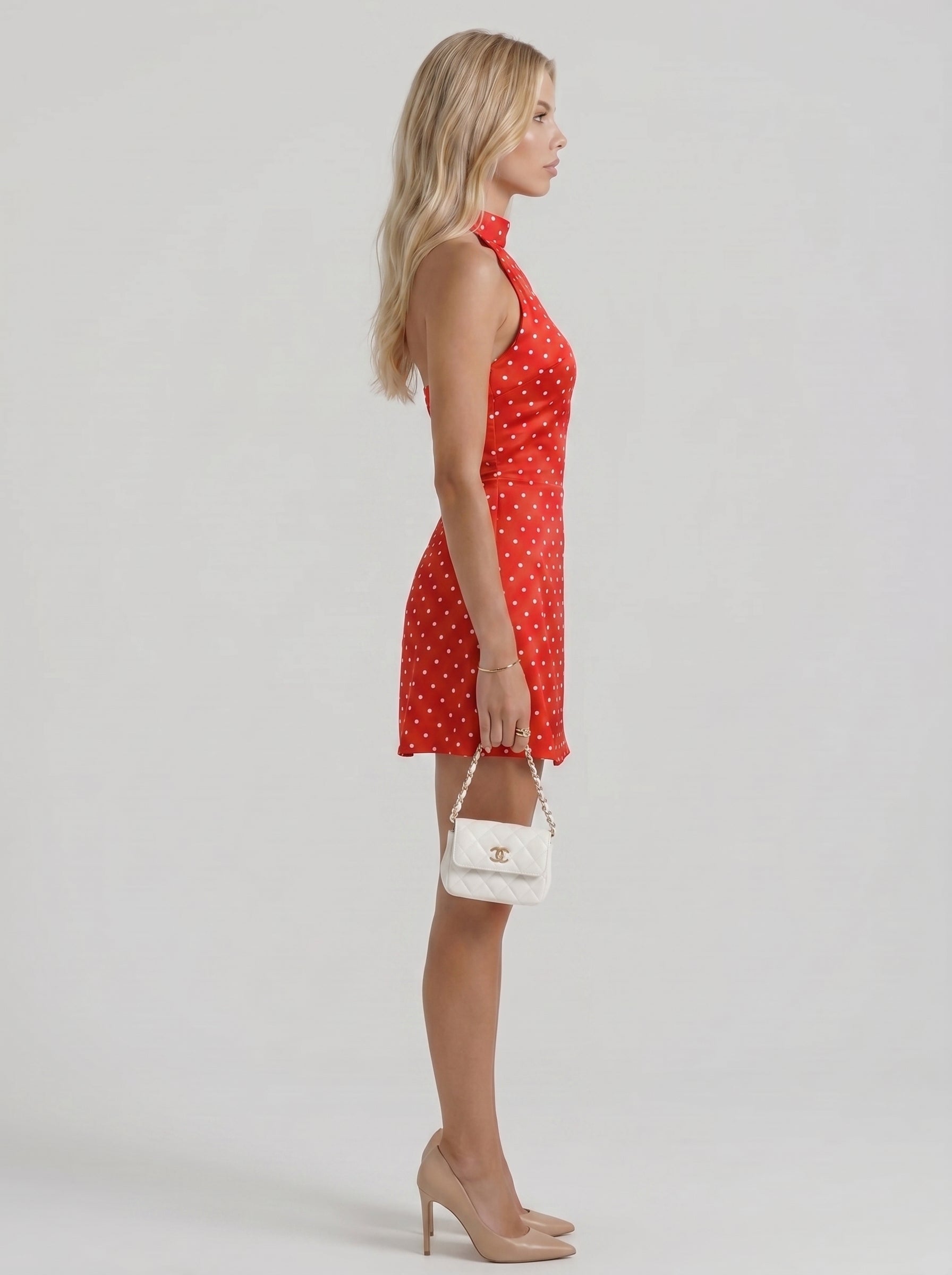 Women red white polka dot high neck halter bodycon mini dress, side profile view