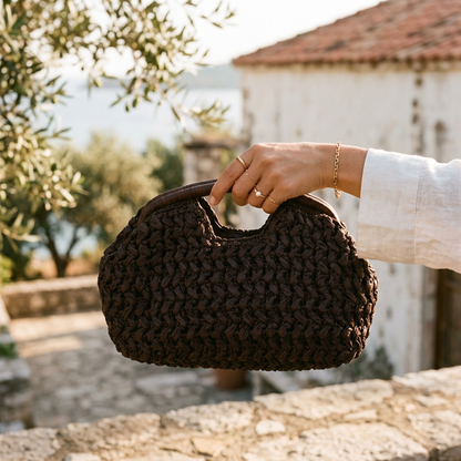 Women brown clutch bag with raffia weave and woven body