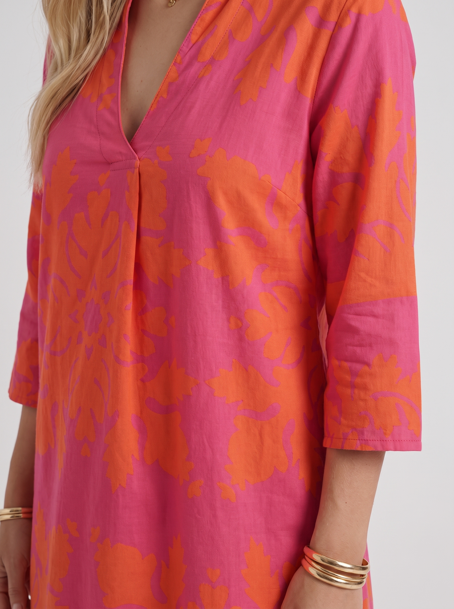 Women orange floral midi dress with v neckline and floral print