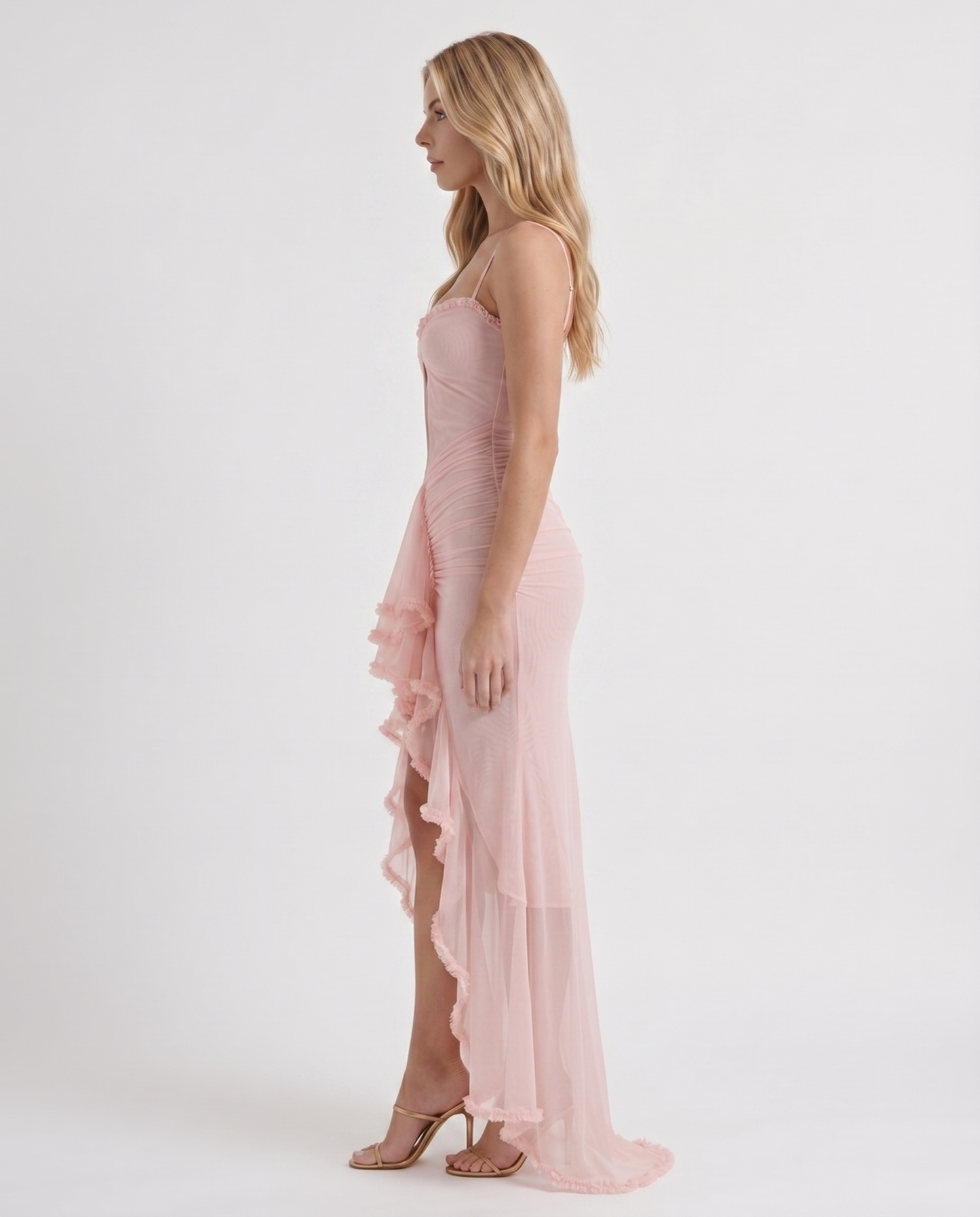 Women pink cutout maxi dress with ruched body and ruffle skirt, side profile
