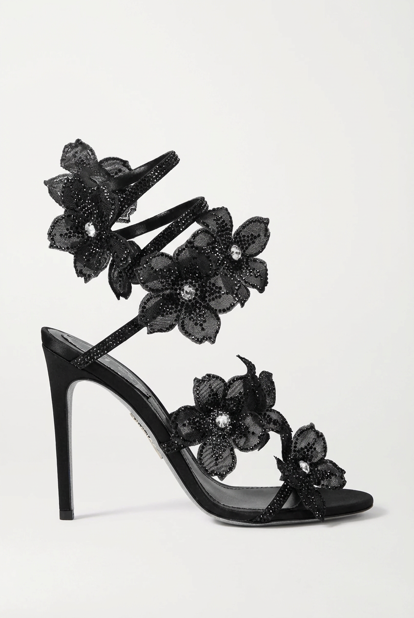 Women black heeled sandals with wrap straps and rhinestone detail