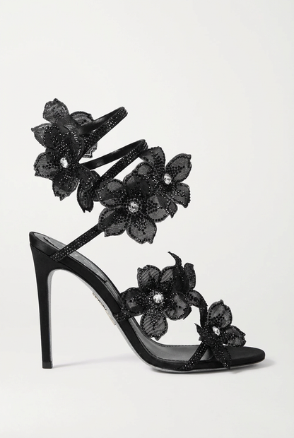Women black heeled sandals with wrap straps and rhinestone detail