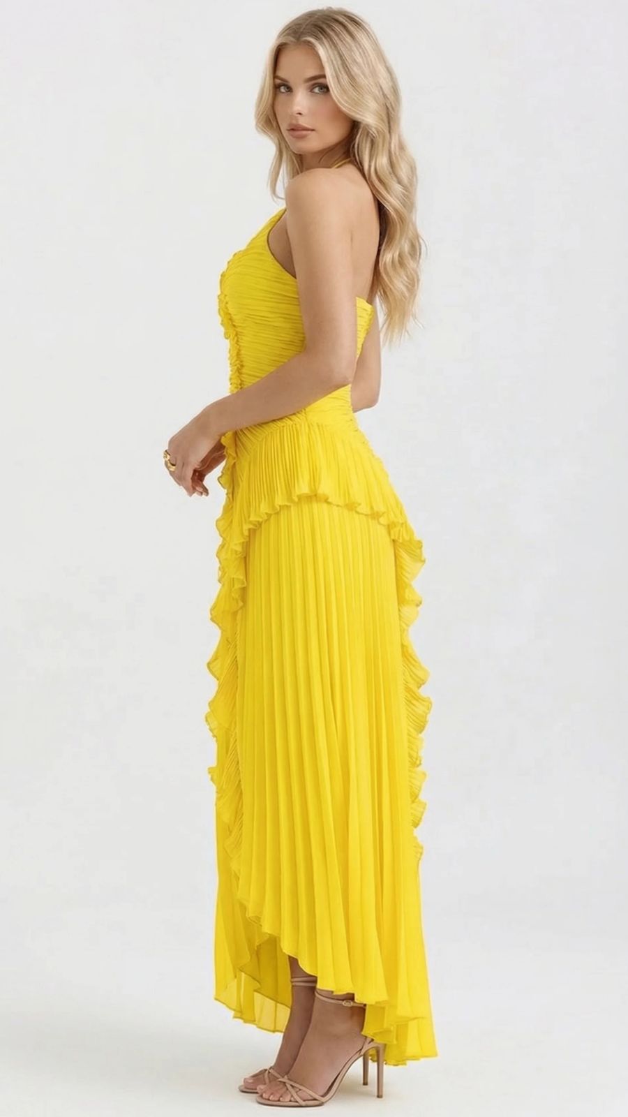 Women's yellow maxi dress with cascading ruffles, side view showing pleated skirt and asymmetric hem