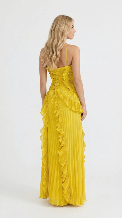 Women's yellow ruffle maxi dress, back view showing lace-up detail and full pleated skirt with ruffles