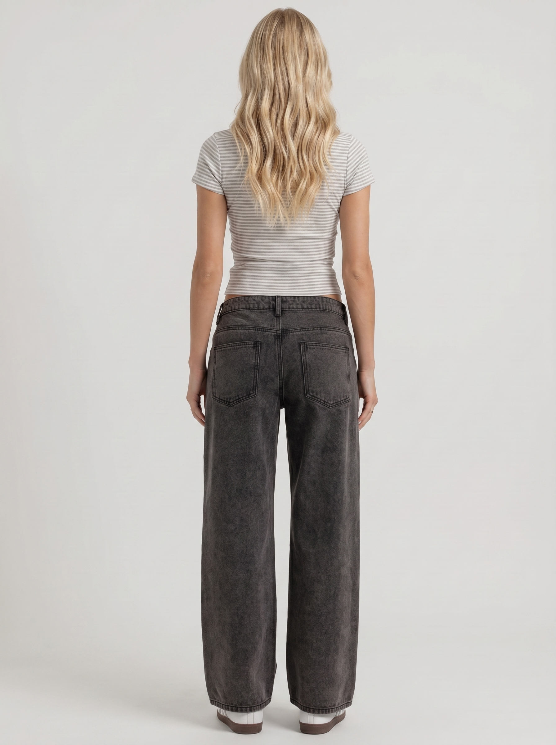 Women black washed low rise wide leg jeans, back view