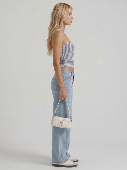 Women blue denim low rise wide leg jeans, side profile view