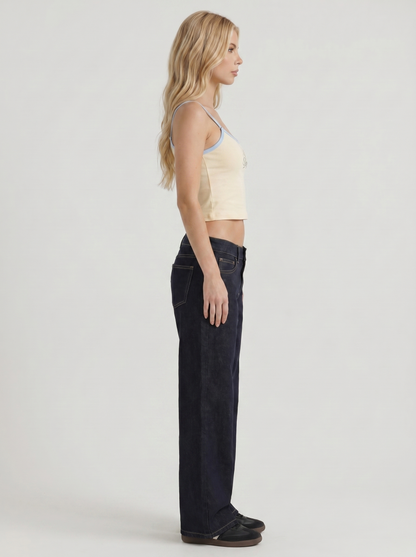 Women indigo blue washed low rise wide leg jeans, side profile view