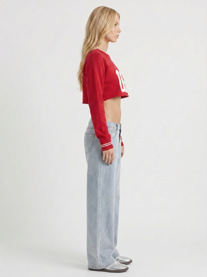 Women light blue with red stitch low rise wide leg jeans, side profile view