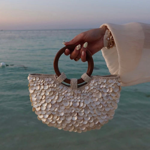 Women ivory handbag with top handle and shell detail