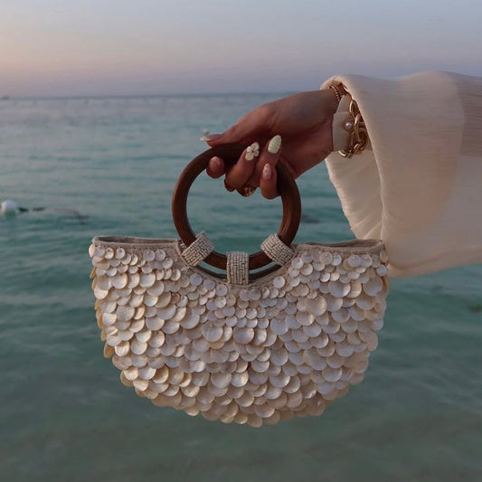 Women ivory handbag with top handle and shell detail