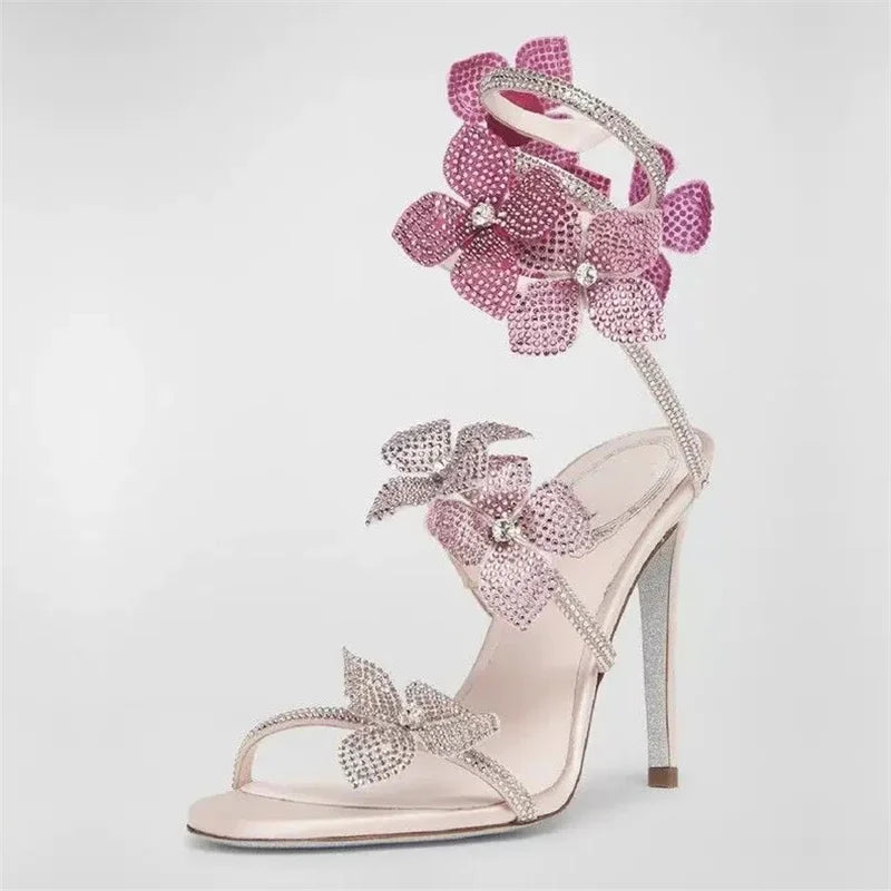 Women baby pink heeled sandals with wrap straps and rhinestone detail