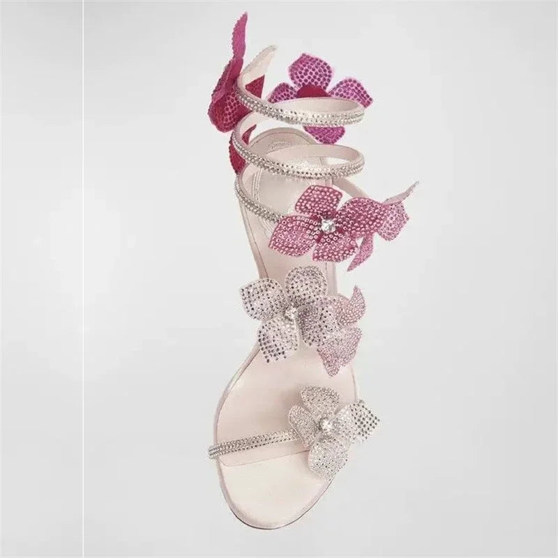 Women baby pink heeled sandals with wrap straps and rhinestone detail