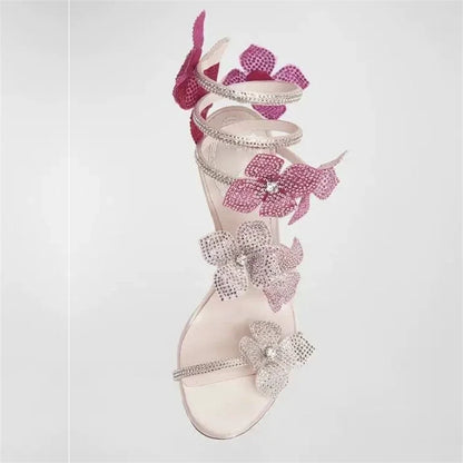 Women baby pink heeled sandals with wrap straps and rhinestone detail