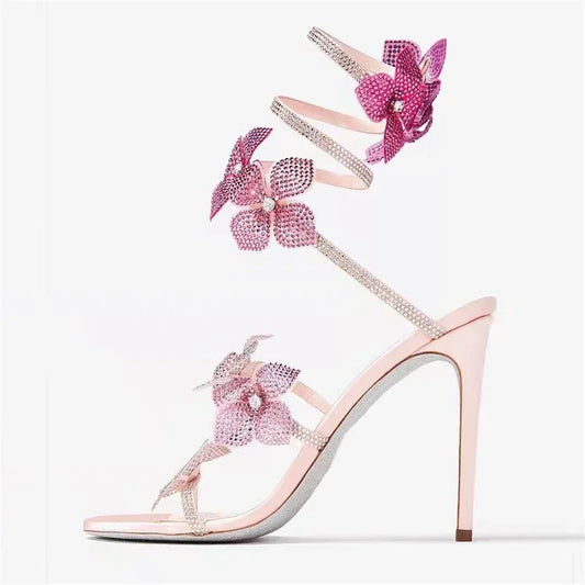 Women baby pink heeled sandals with wrap straps and rhinestone detail