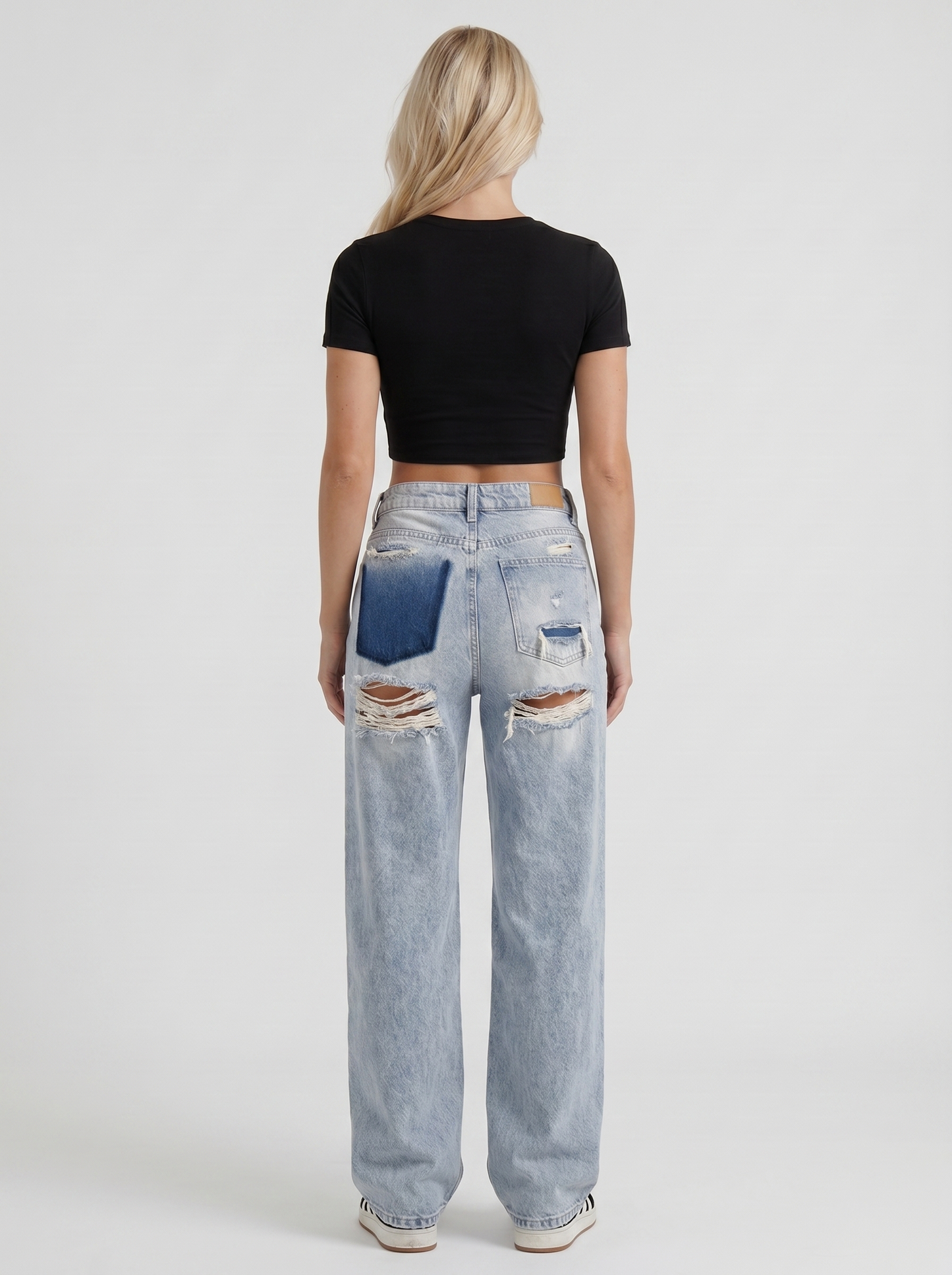 Women light blue baggy mid rise distressed wide leg jeans, back view