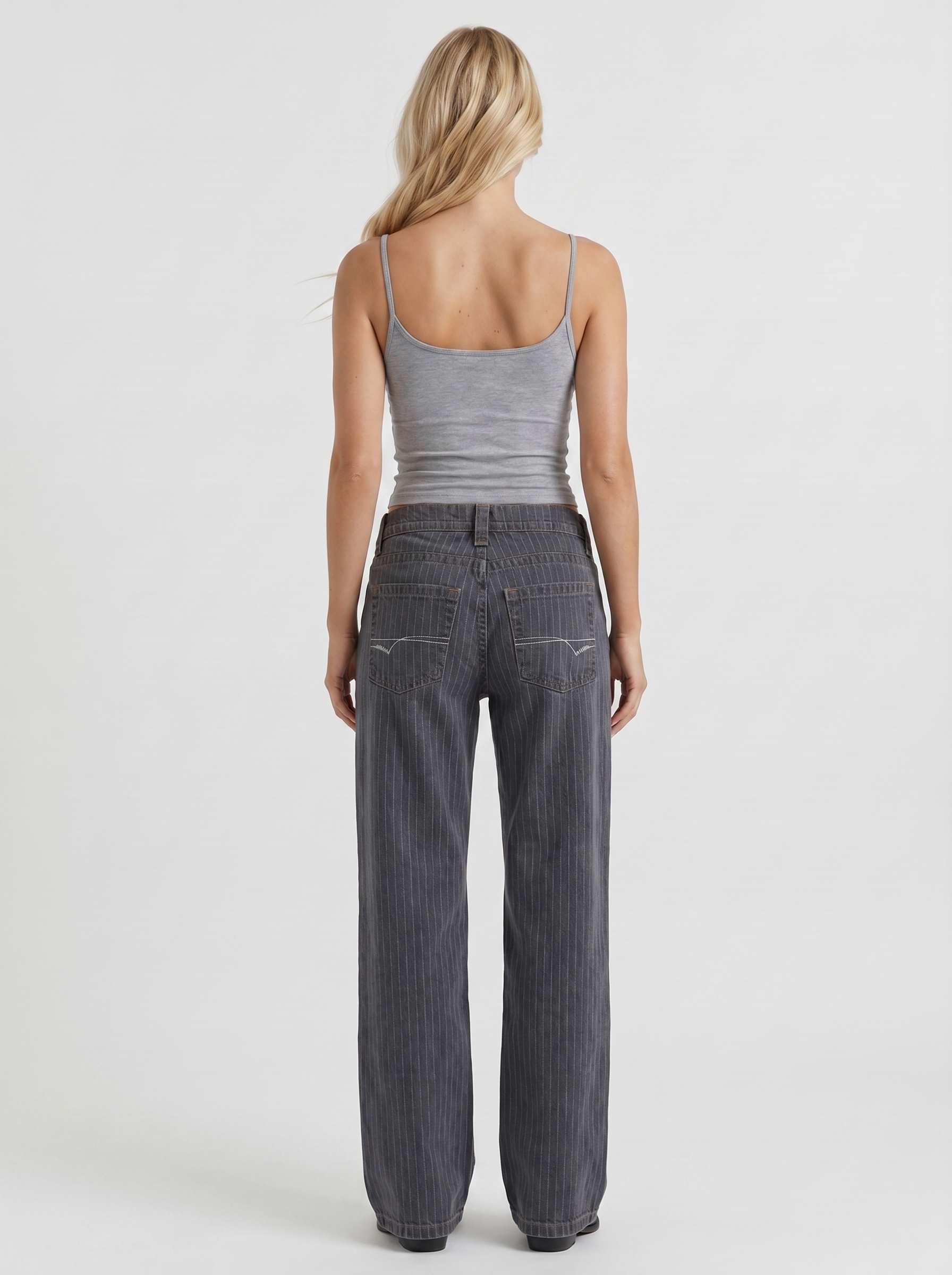 Women charcoal blue low rise pinstripe wide leg jeans, back view