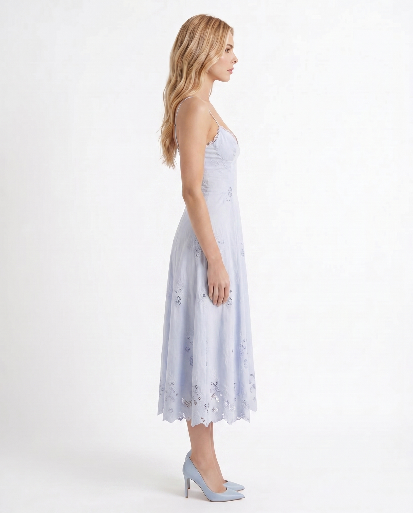 Women blue V neck midi dress with embroidered scalloped hem, side profile