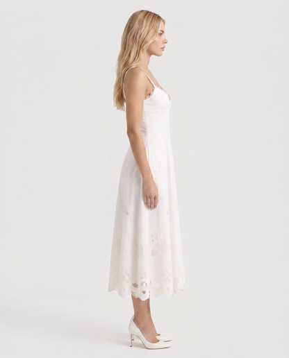 Women white V neck midi dress with embroidered scalloped hem, side profile
