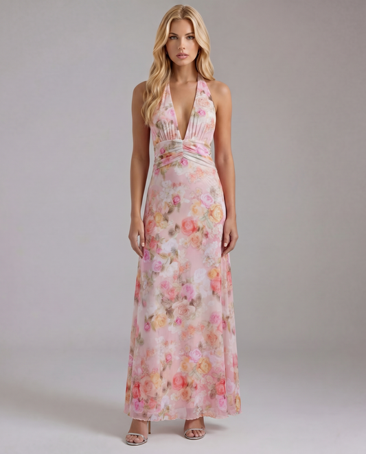 Front view of a pink floral plunge maxi dress with a ruched empire waist and flowing skirt