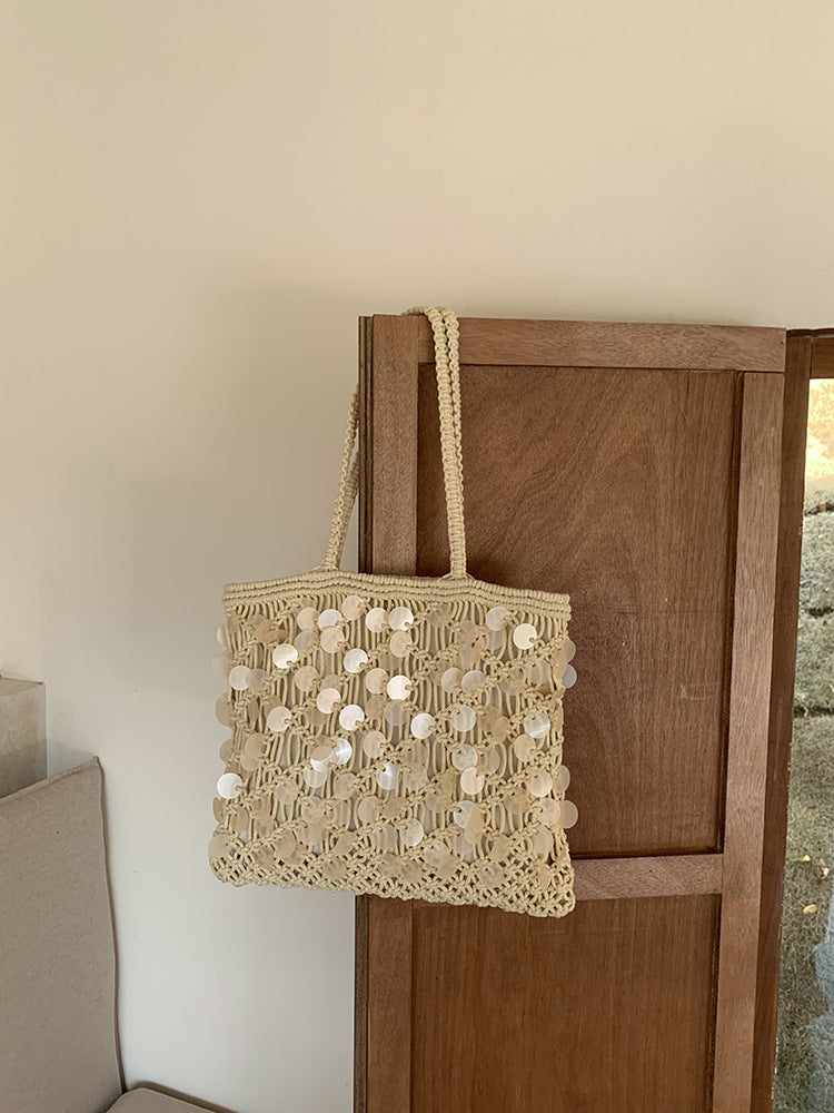 Women ivory tote bag with sequin finish and woven body