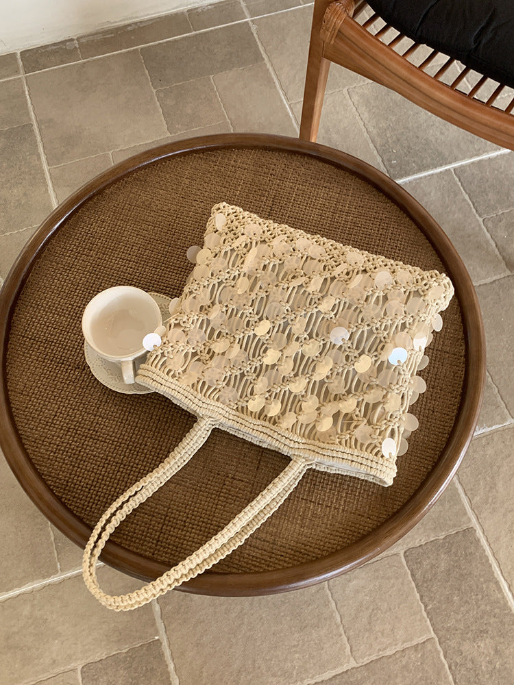 Women ivory tote bag with sequin finish and woven body