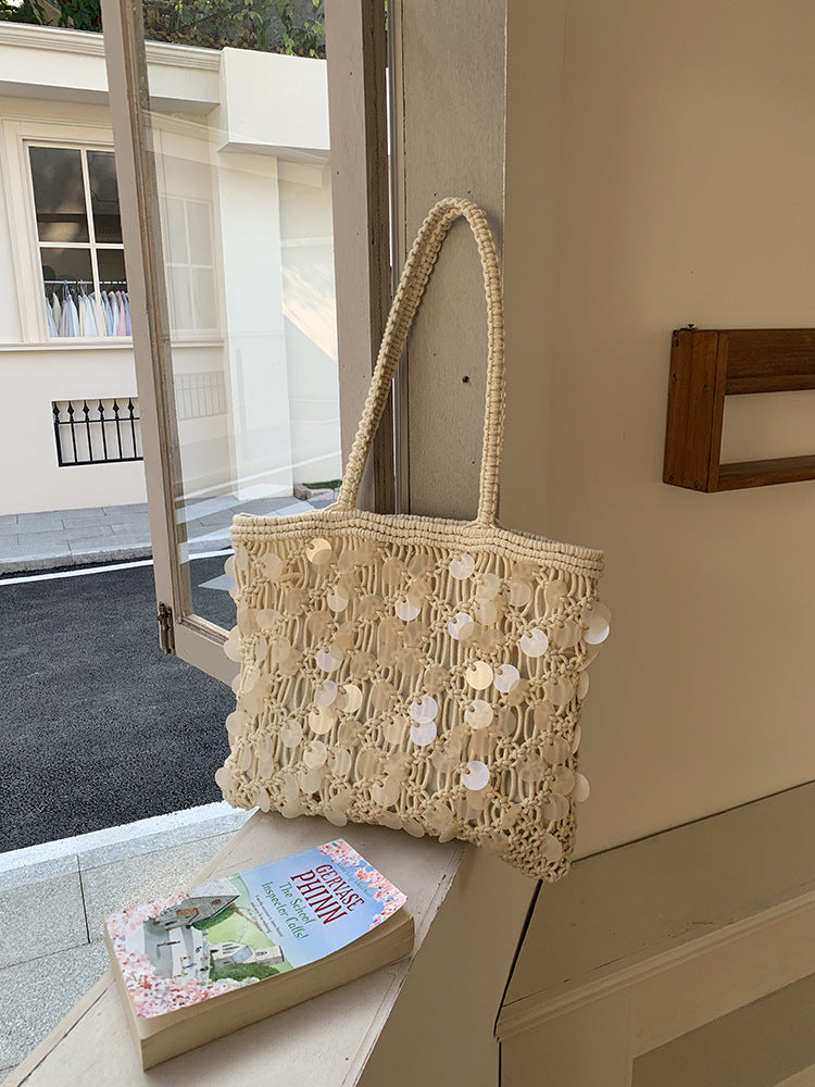 Women ivory tote bag with sequin finish and woven body