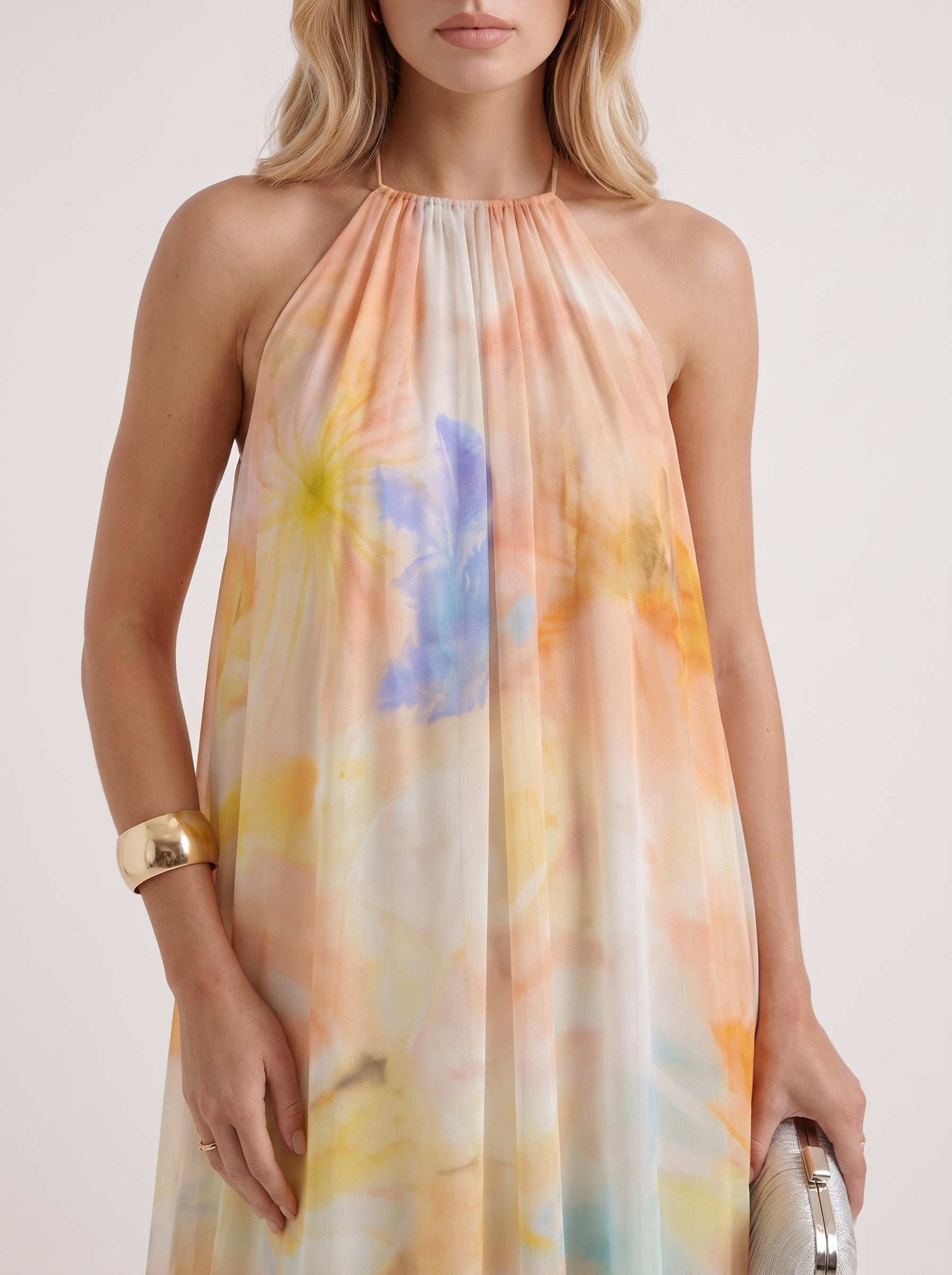 Women orange maxi dress with halter neckline and chiffon fabric