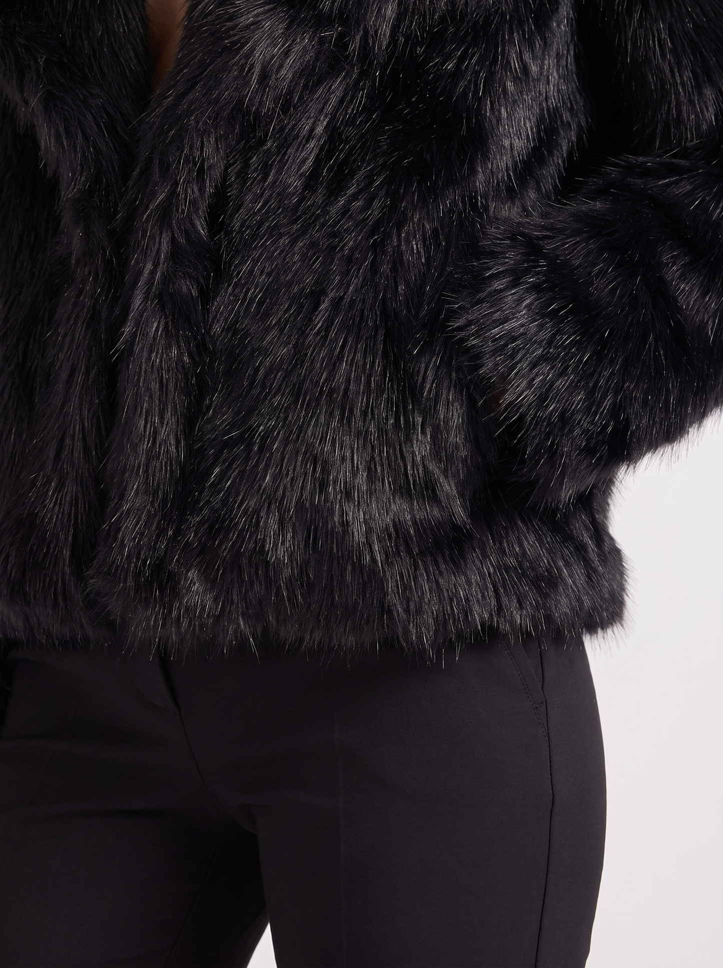 Women's black shaggy jacket with long pile texture and hip length hem