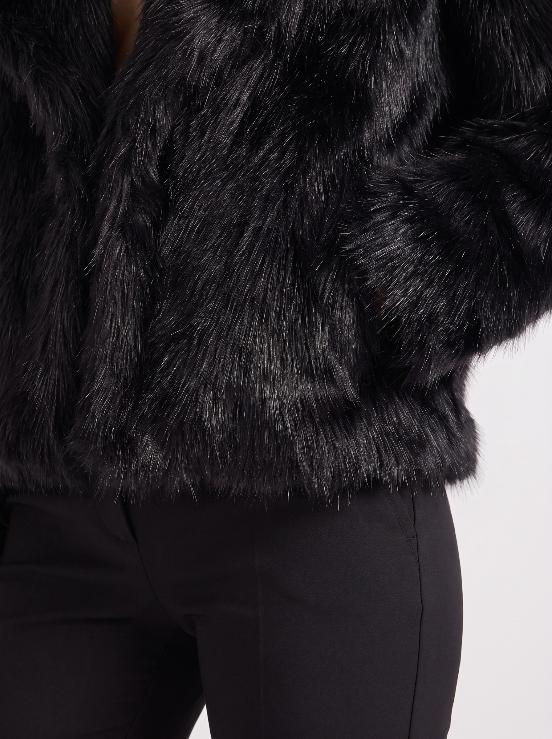 Women's black shaggy jacket with long pile texture and hip length hem