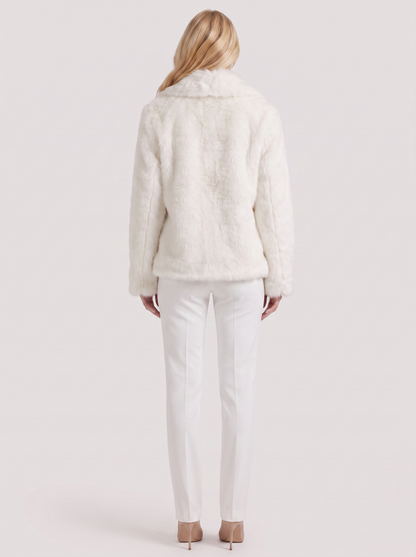 Women's white shaggy jacket with long pile texture and hip length hem