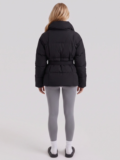 Women's black puffer jacket with quilted panels and zip front
