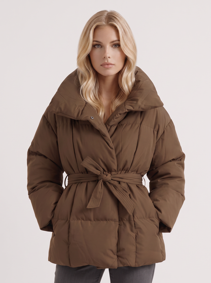Women's brown puffer jacket with quilted panels and zip front