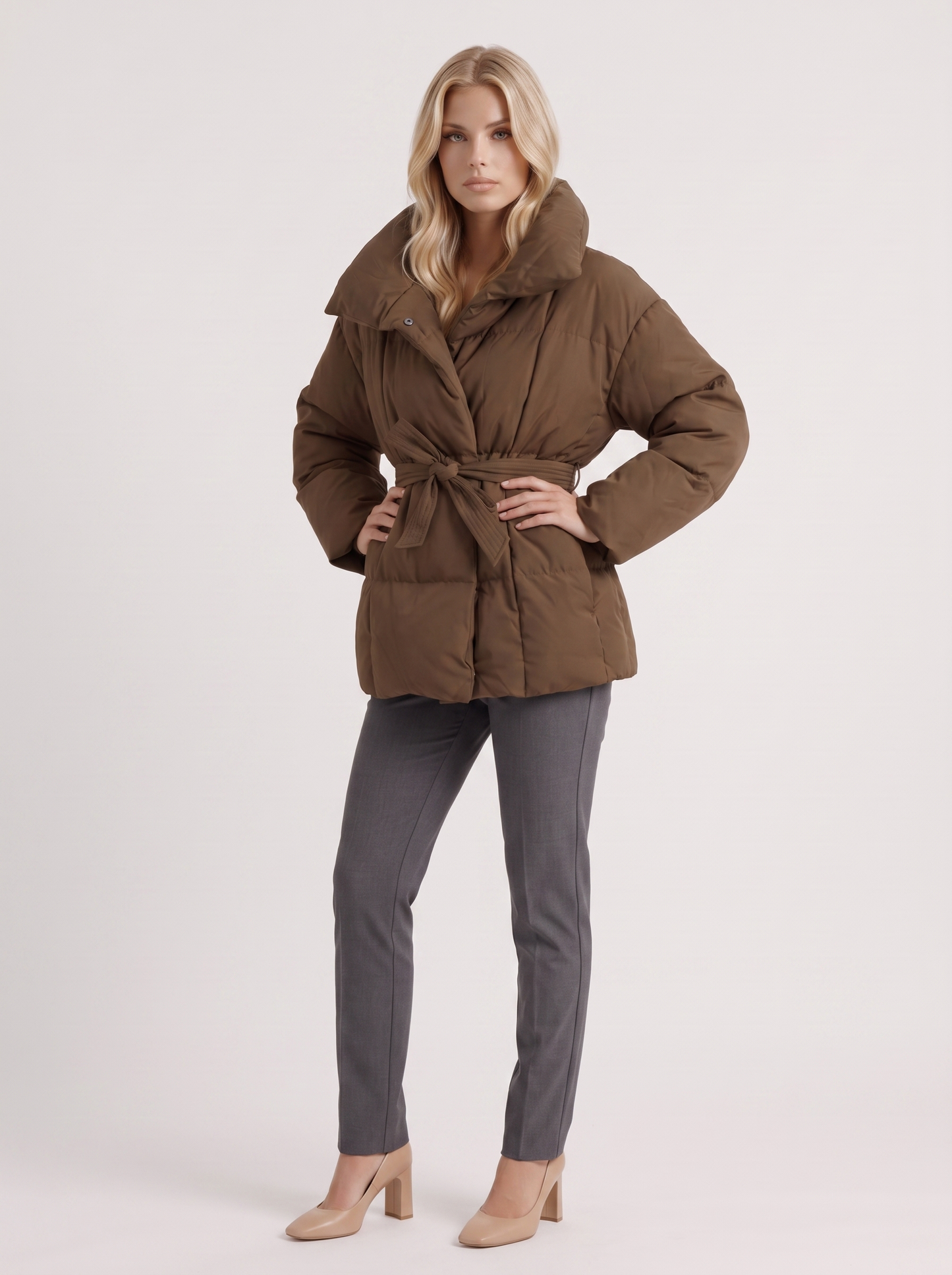 Women's brown puffer jacket with quilted panels and zip front