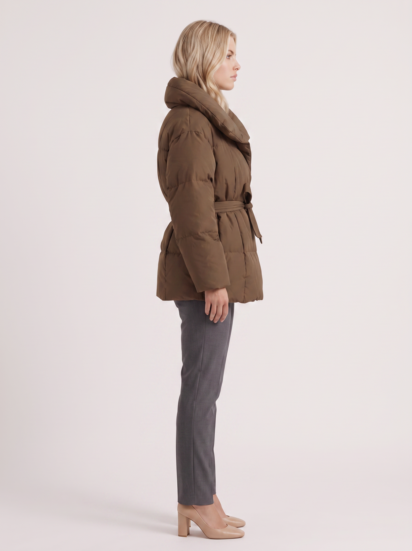 Women's brown puffer jacket with quilted panels and zip front