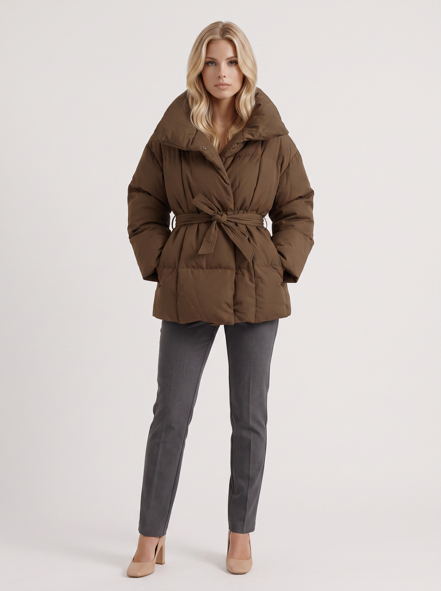 Women's brown puffer jacket with quilted panels and zip front