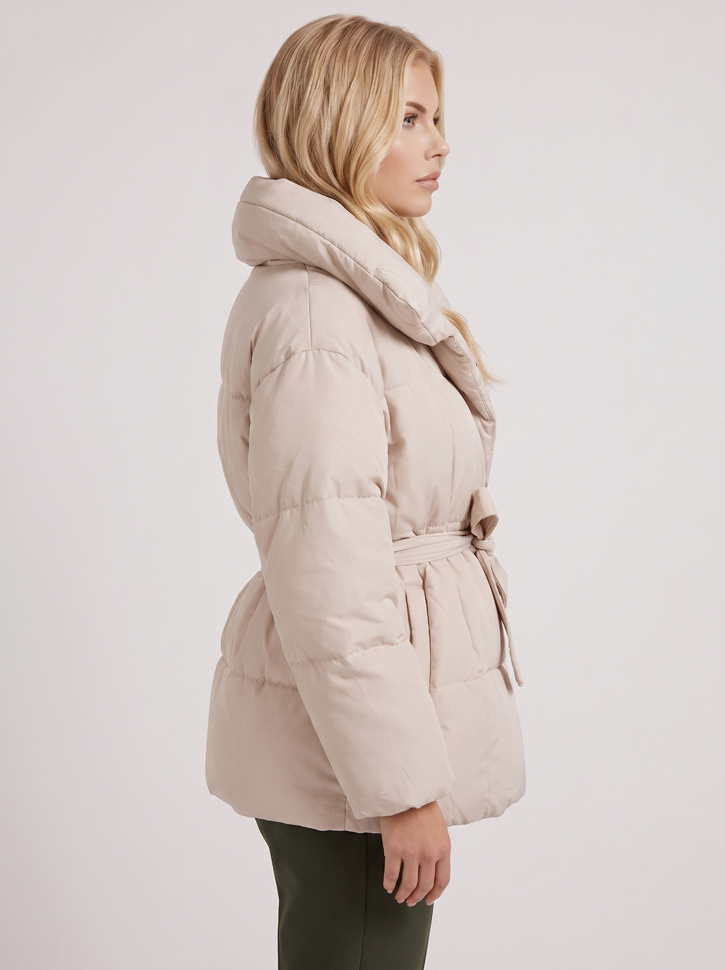 Women's white puffer jacket with quilted panels and zip front