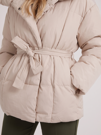 Women's white puffer jacket with quilted panels and zip front