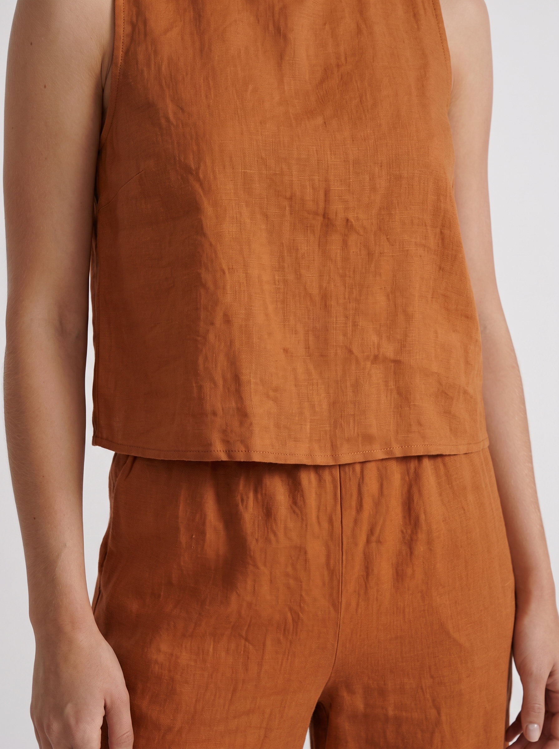 Women khaki pants set with sleeveless linen top and round neckline